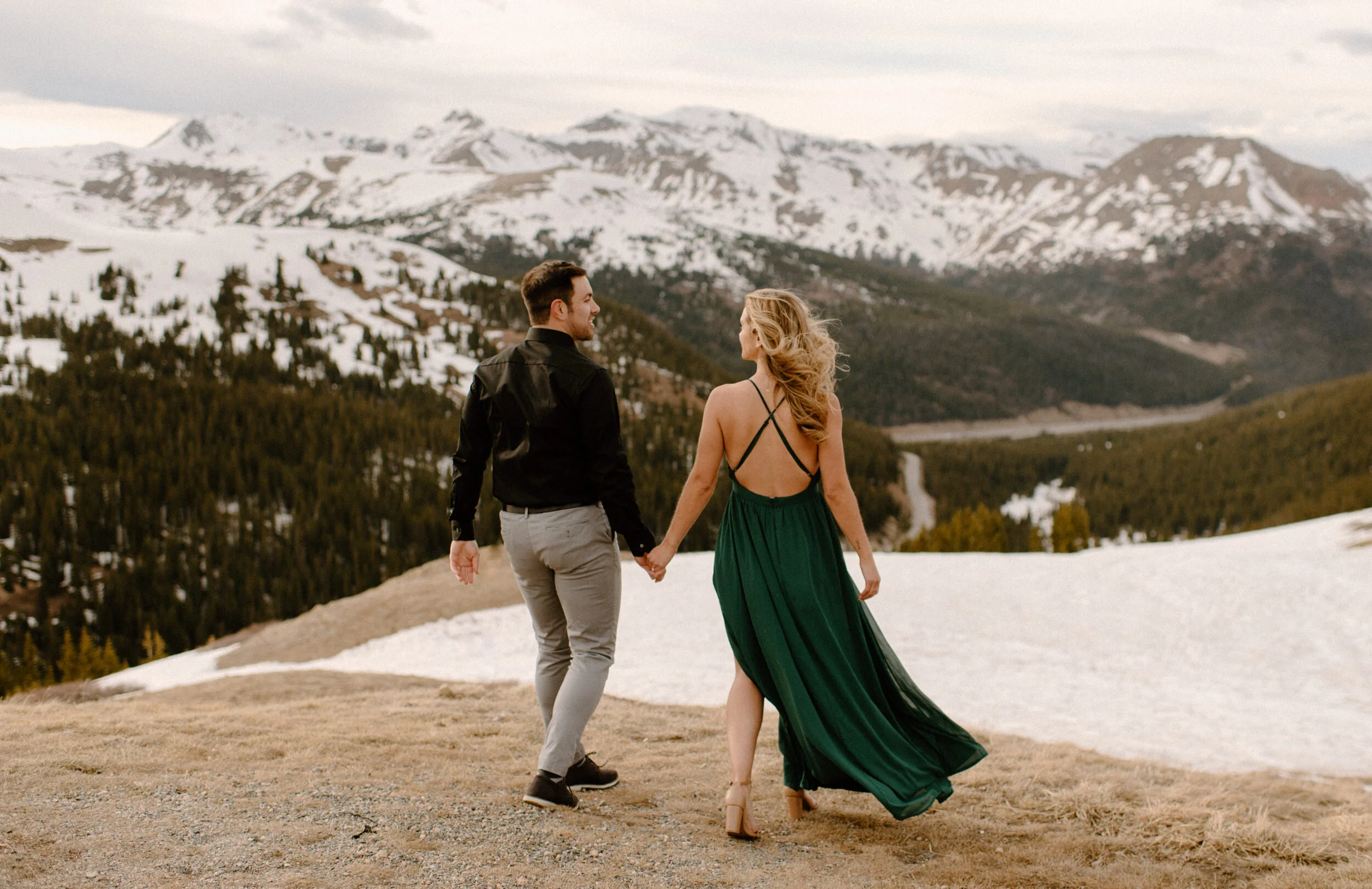  Colorado winer engagement photos on Loveland Pass. Loveland Pass engagement session. Colorado wedding and elopement photographer, Alyssa Carpenter. Adventure engagement photography. Engagement session dress ideas. Flowy engagement session dress. Colorado engagement photos.  