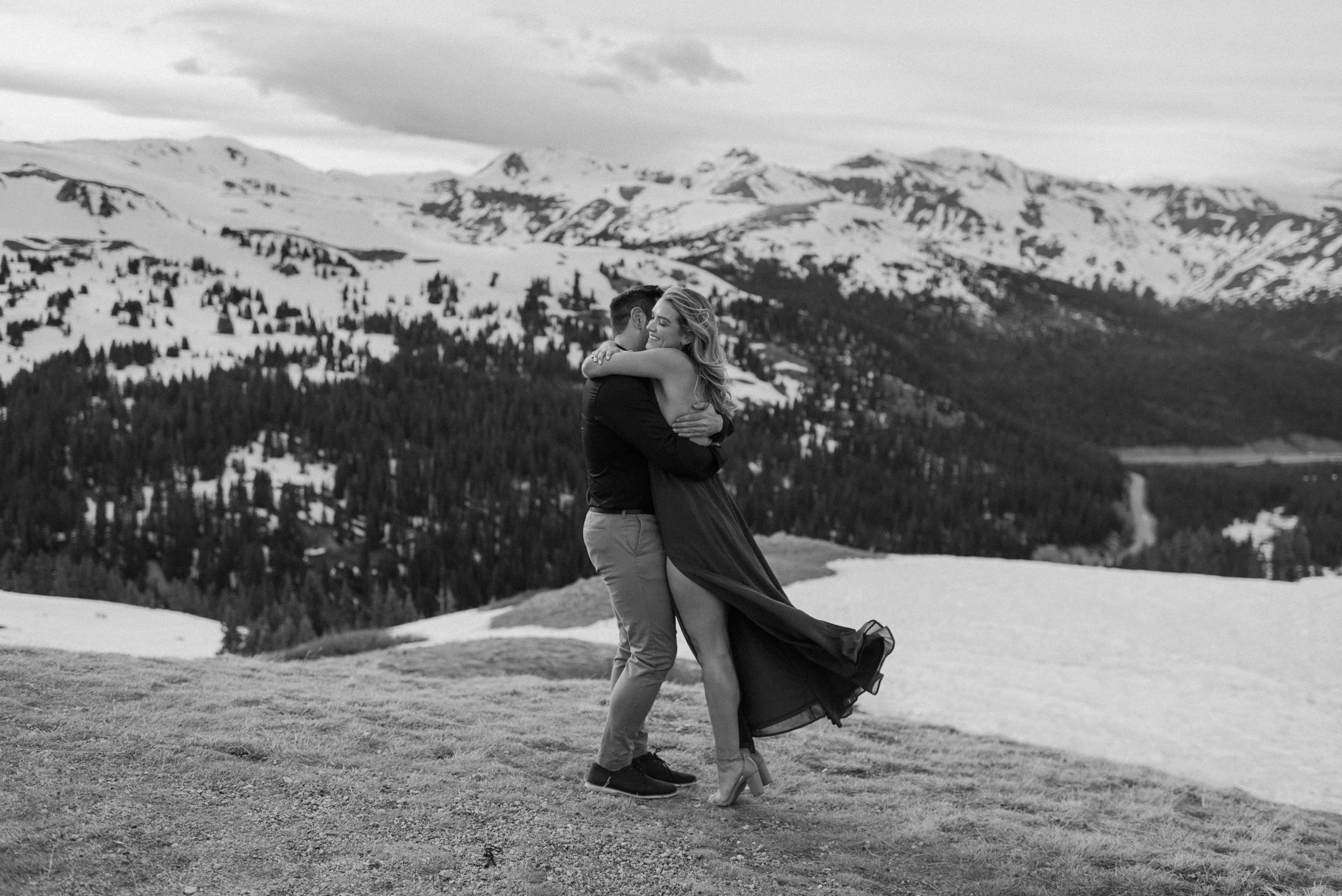  Colorado winer engagement photos on Loveland Pass. Loveland Pass engagement session. Colorado wedding and elopement photographer, Alyssa Carpenter. Adventure engagement photography. Engagement session dress ideas. Flowy engagement session dress. Colorado engagement photos on Loveland Pass.  