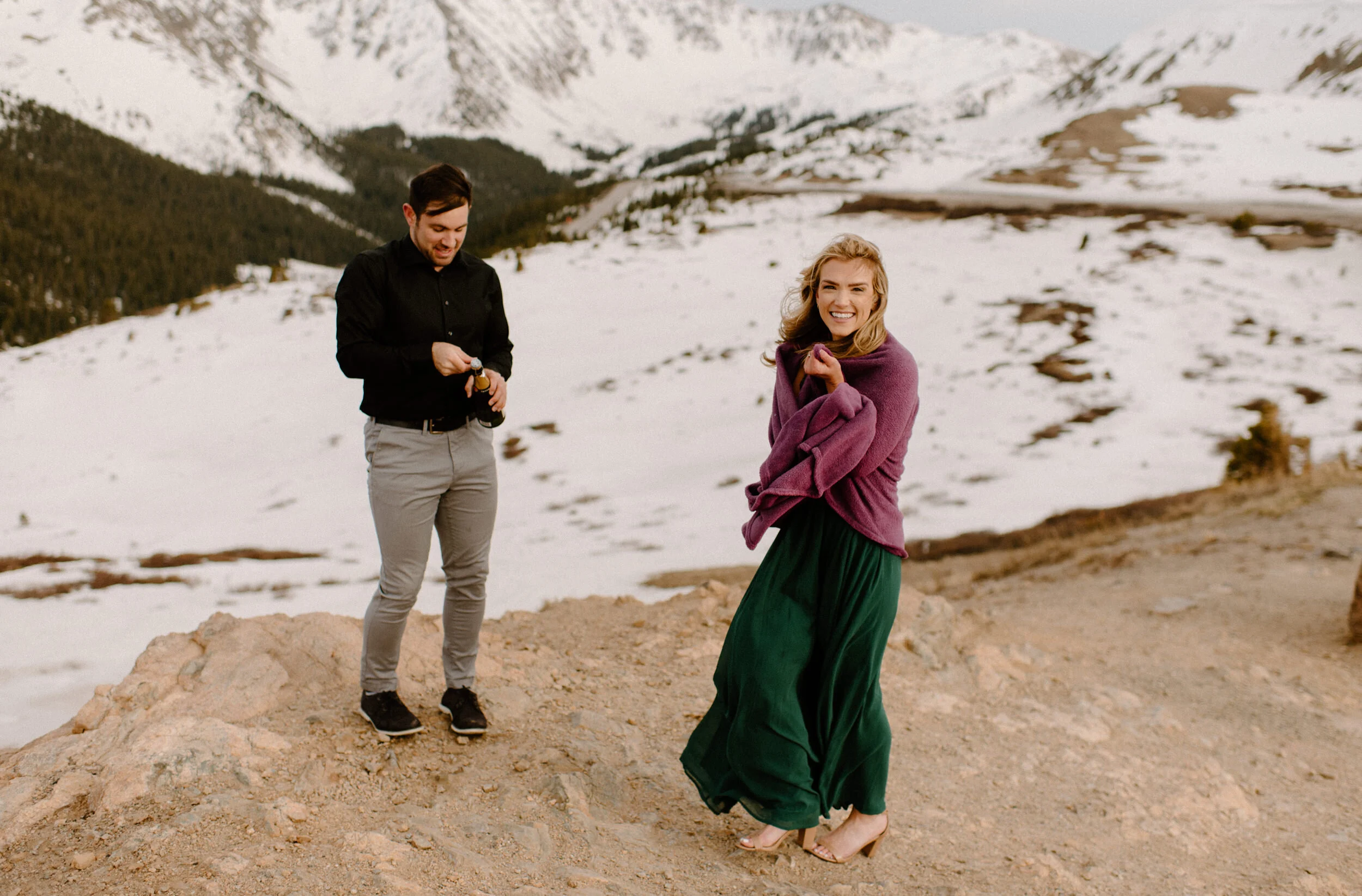  Snowy engagement session on Loveland Pass. Loveland Pass engagement photos. Champagne engagement photo ideas. Colorado wedding photographer. Colorado mountain engagement session.  